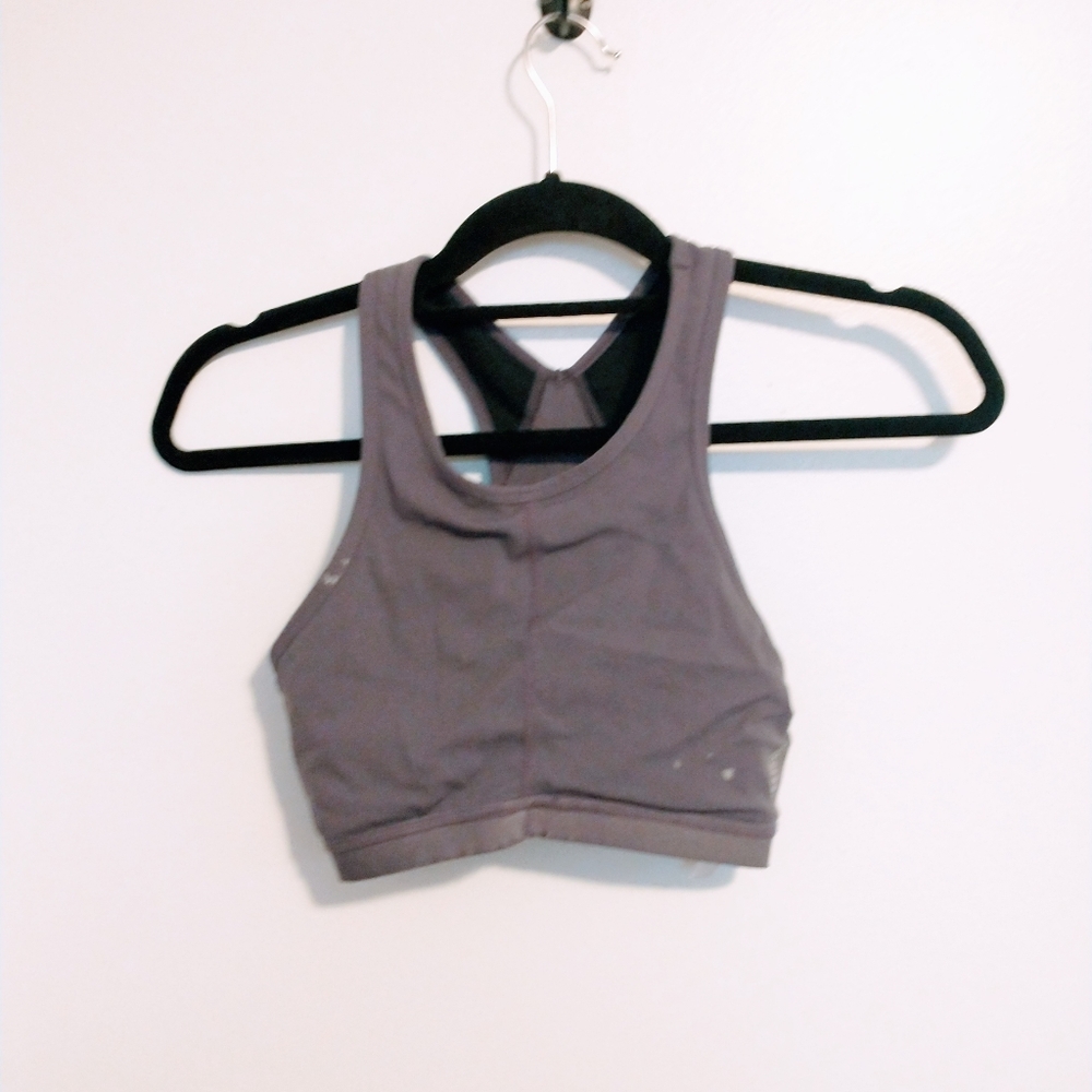Free People intimates dusty purple sports bra with laser cutout back. Has stain